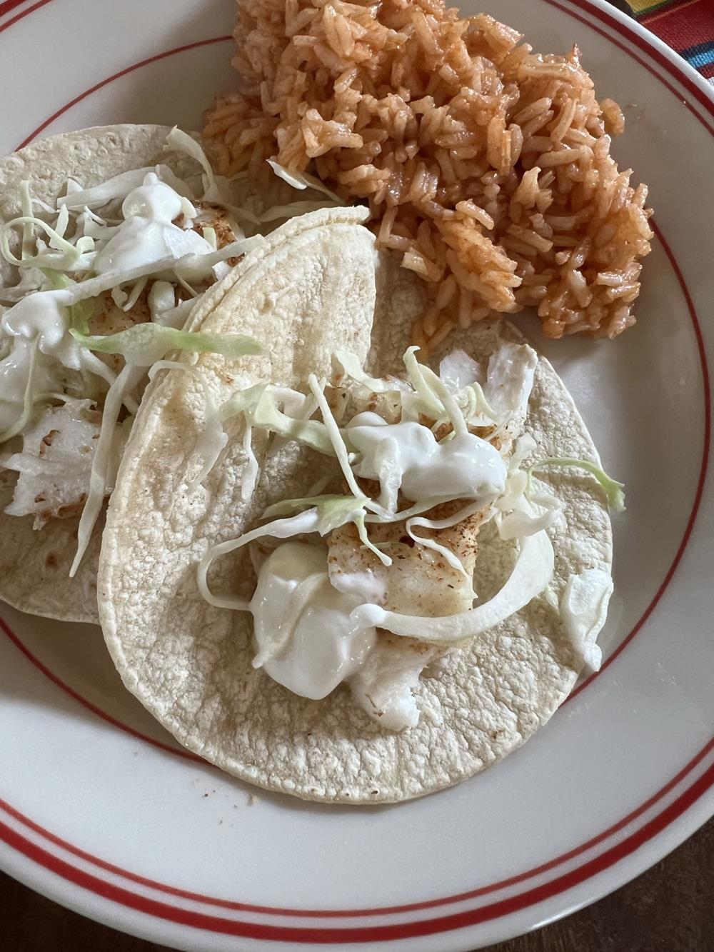 fish tacos on corn tortillas with Mexican rice