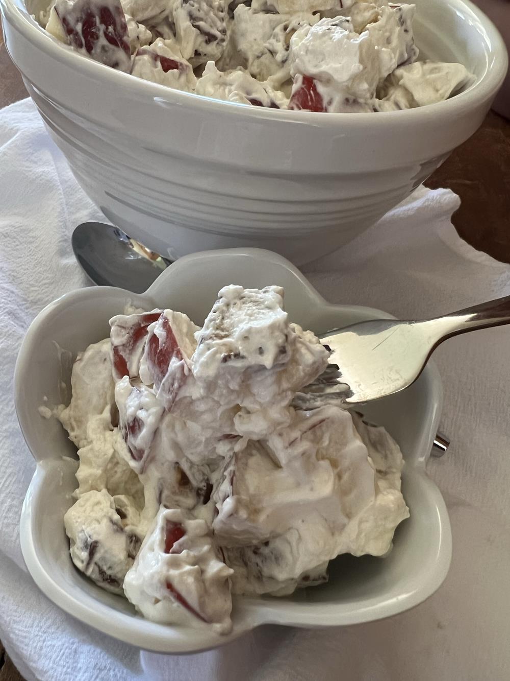 Snickers Apple Salad in bowl with fork