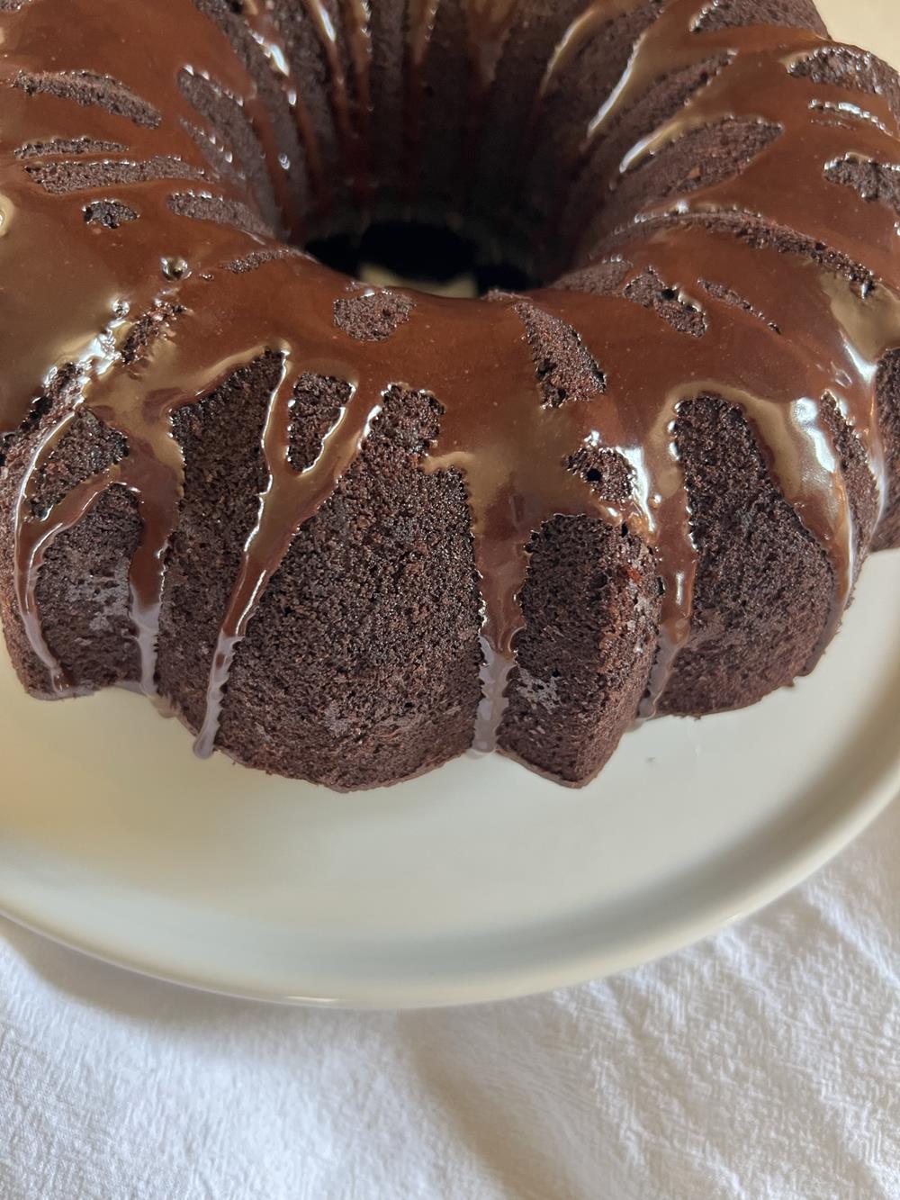 Chocolate Zucchini Bundt Cake on white platter