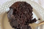 Gluten Free Chocolate Zucchini Bundt Cake on white plate with fork