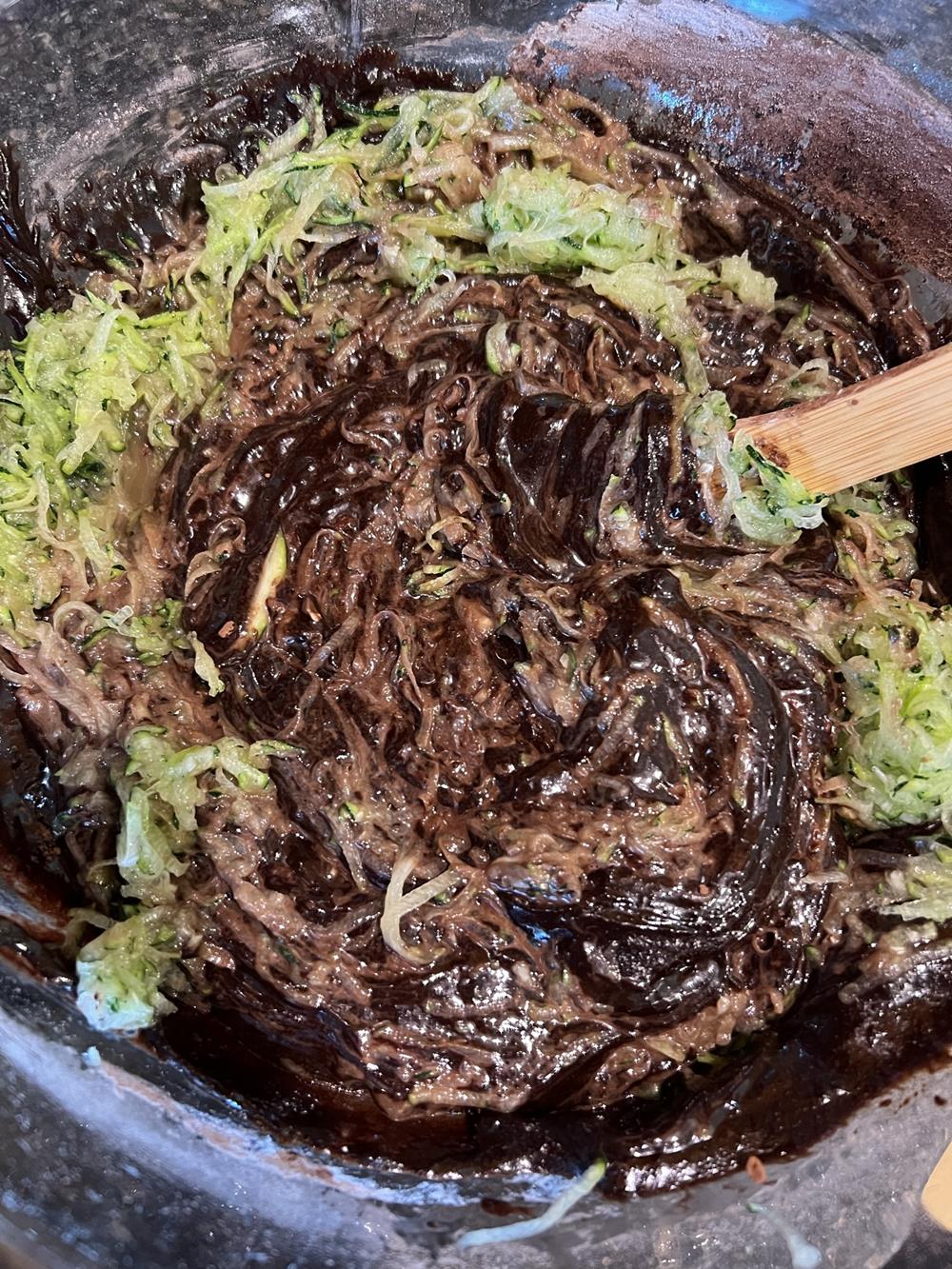 Gluten Free Chocolate Zucchini Bundt Cake with Chocolate Chips batter in glass bowl