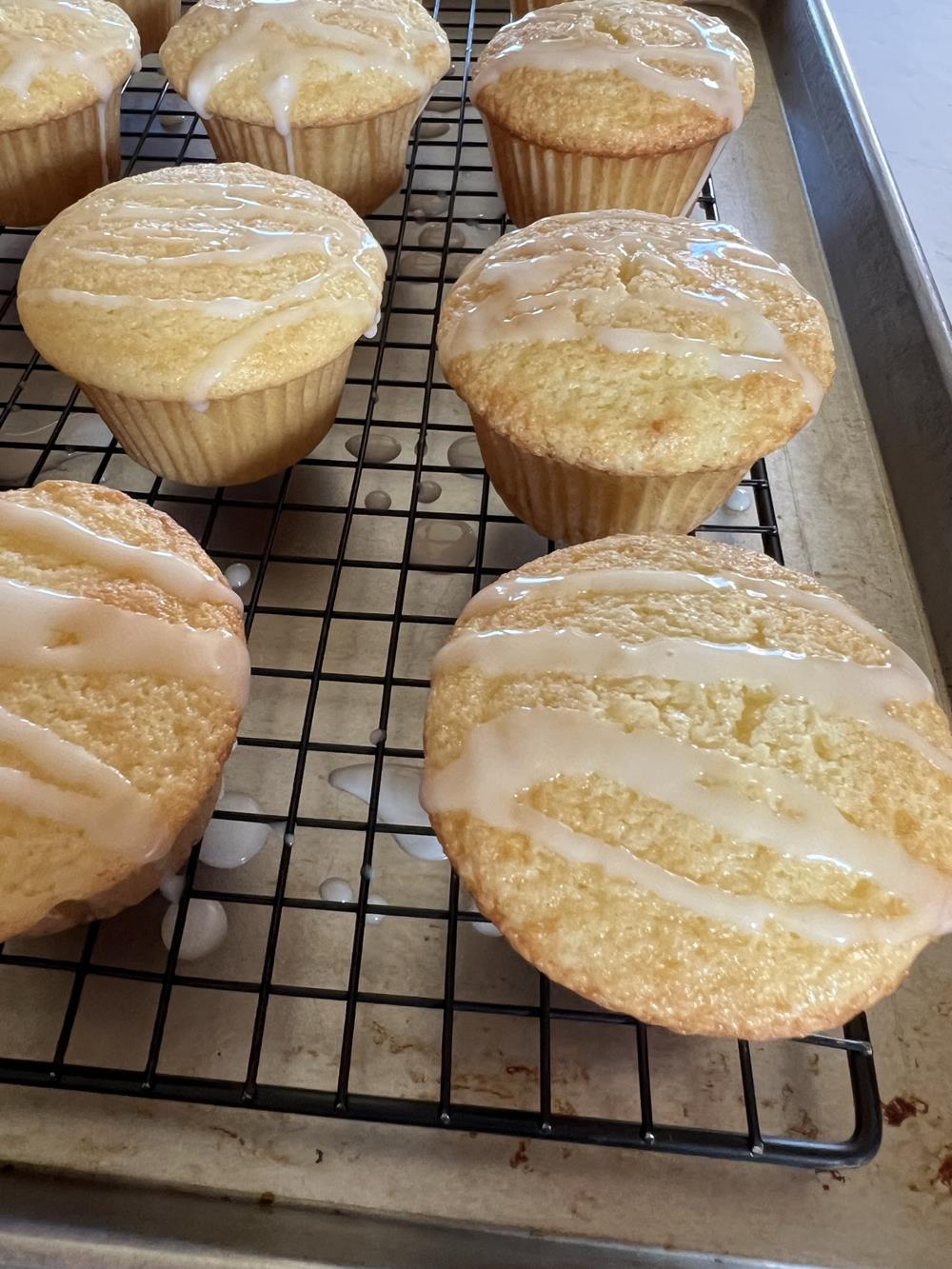 Gluten Free Lemon Muffins with glaze on cooling rack