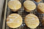 Gluten Free Lemon Muffins on cooling rack on cookie sheet