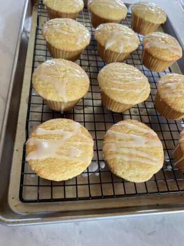 Gluten Free Lemon Muffins on cooling rack on cookie sheet