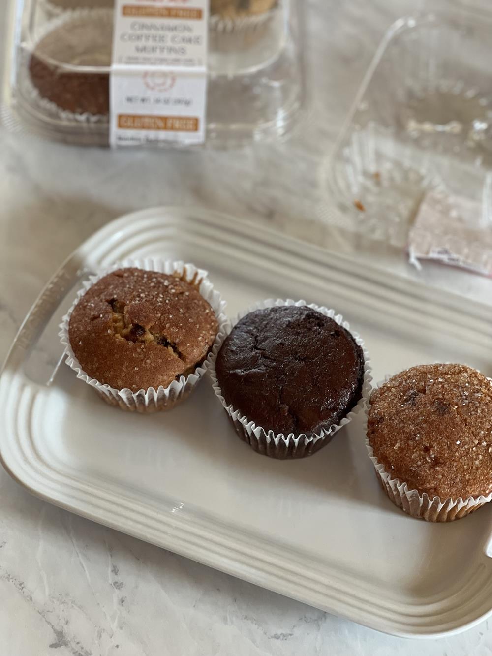 gluten free muffins on white plate with package in the background