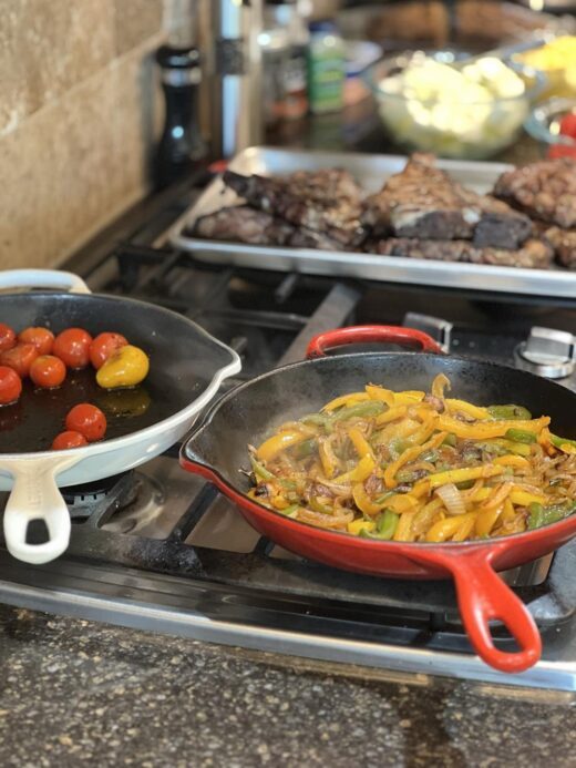 steak and vegetables on stove and counter