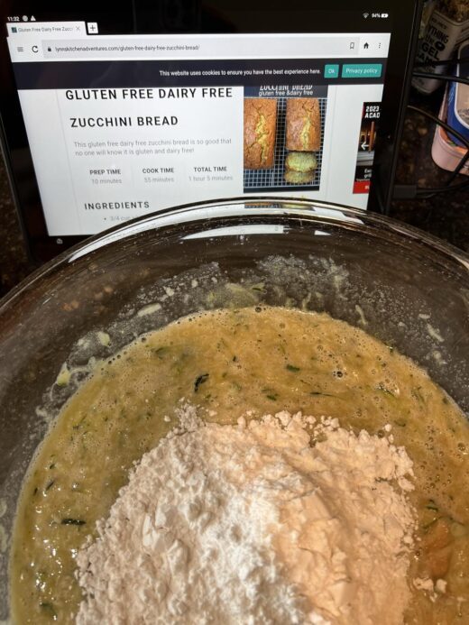 zucchini bread batter in a glass bowl