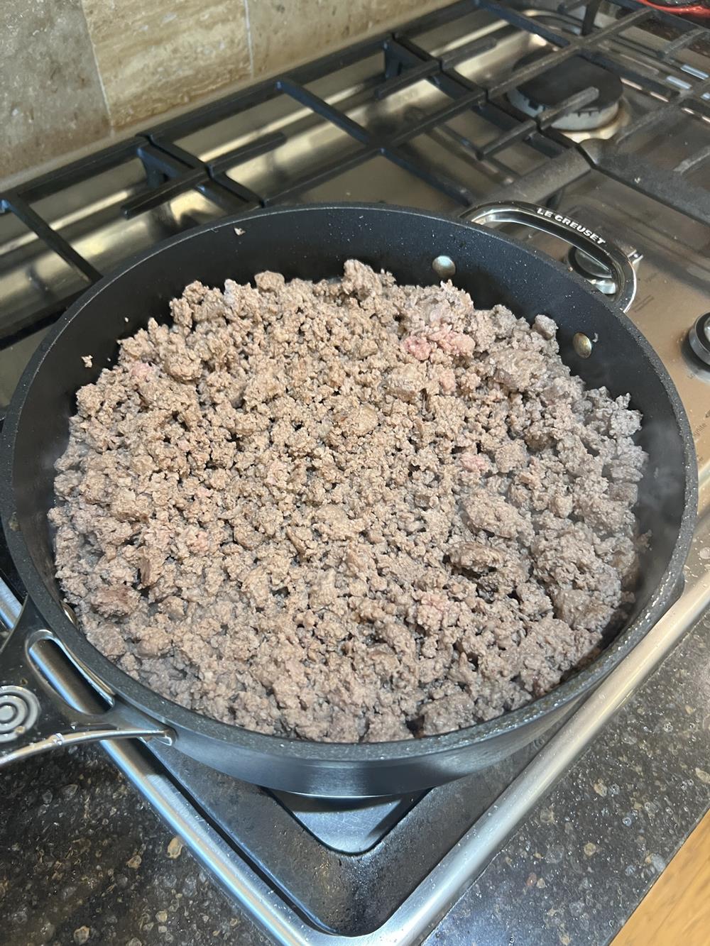 ground beef cooking on the stove