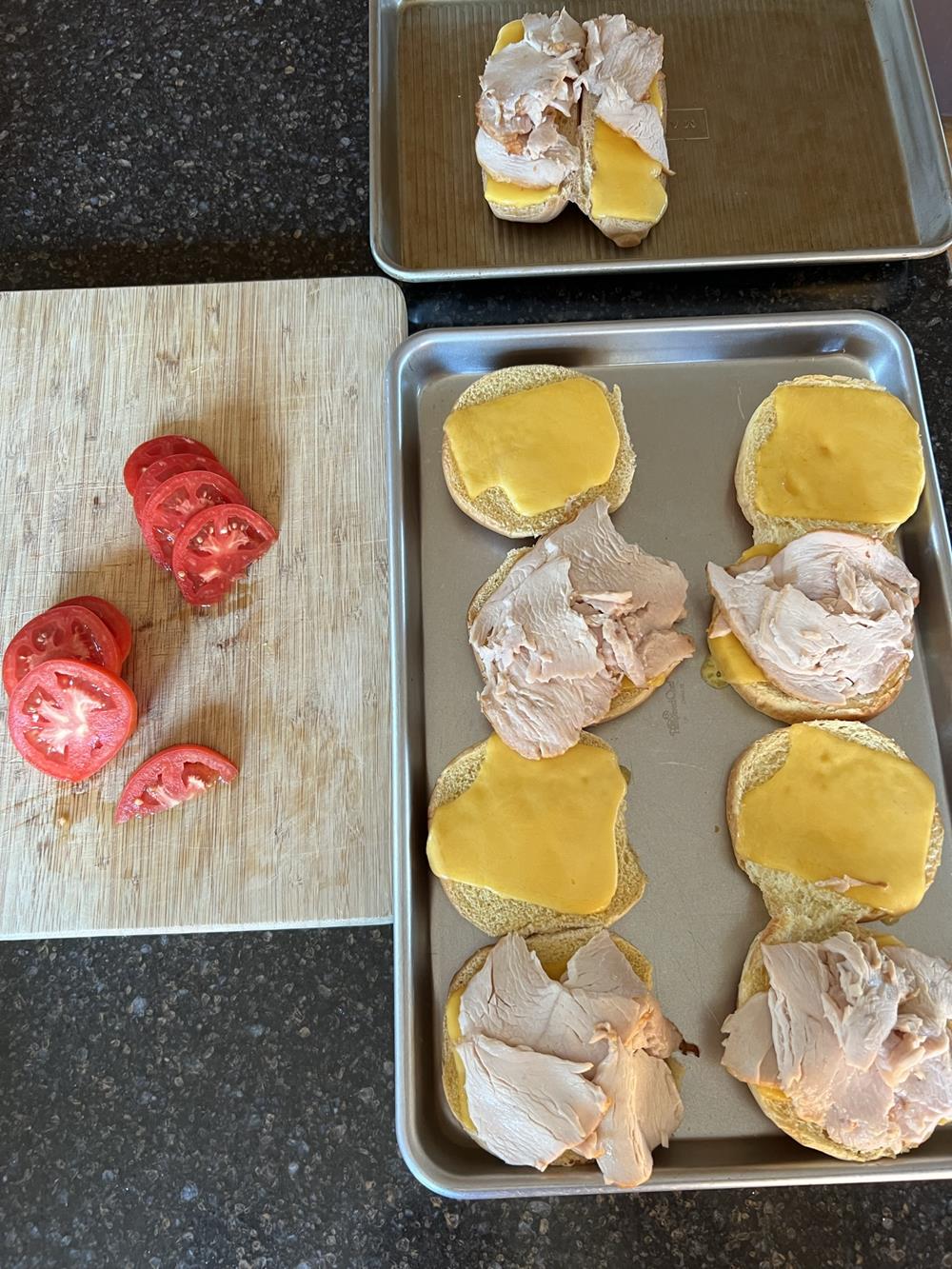 turkey cheese sandwiches on cookie sheet