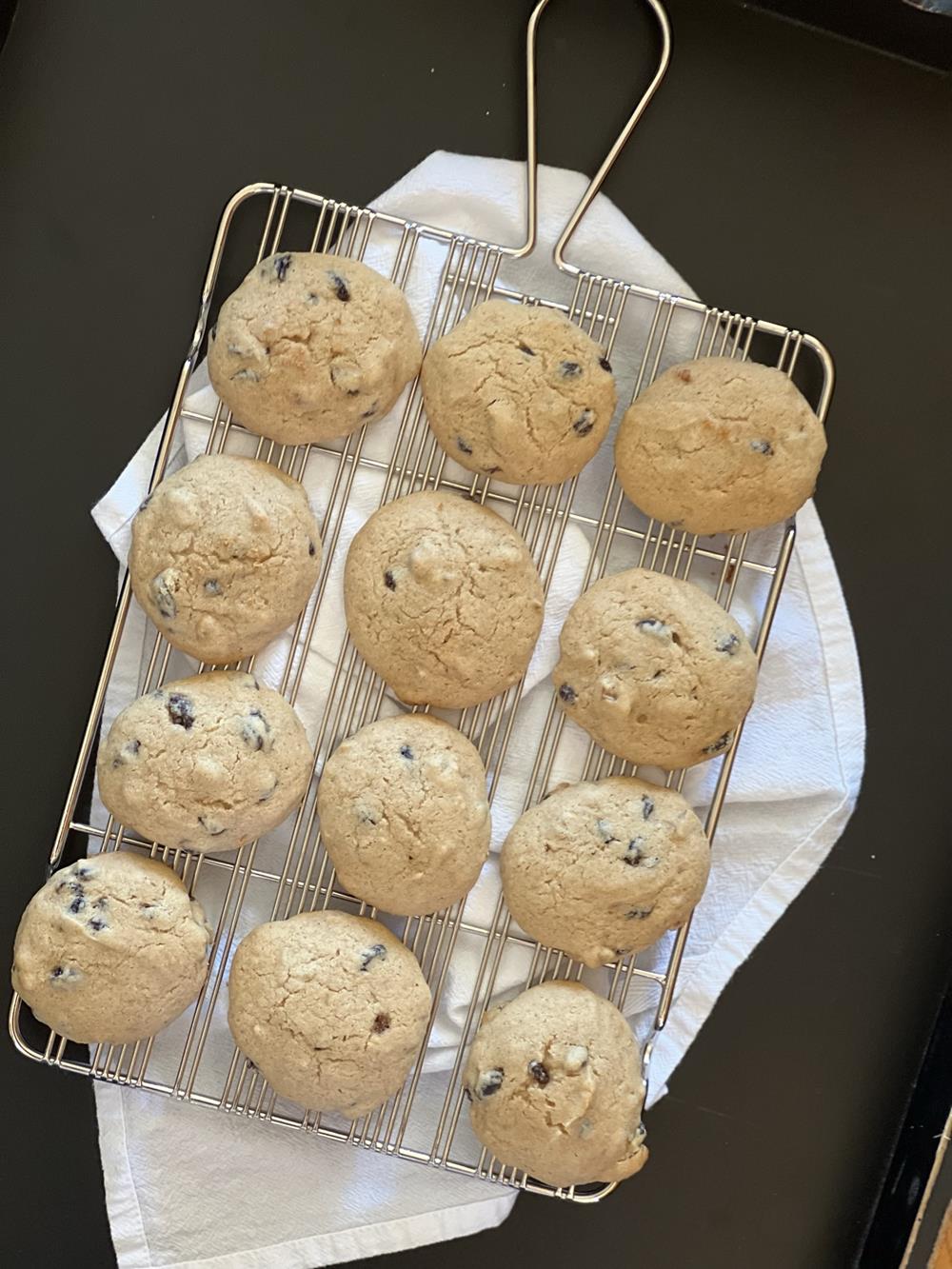 applesauce cookies on cooling rack with black background