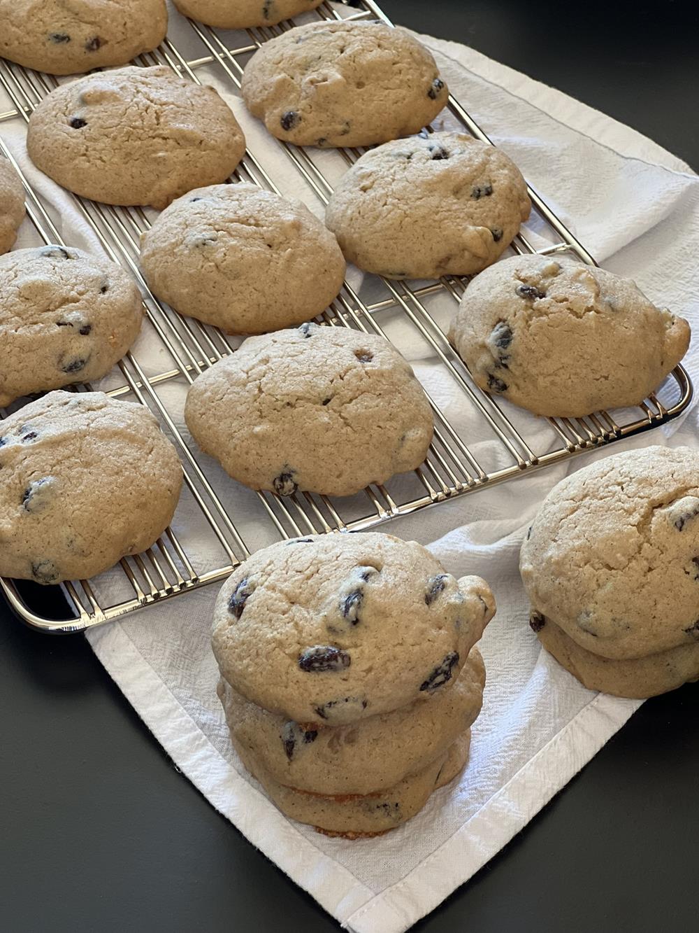 applesauce cookies on wire rack on white kitchen towel