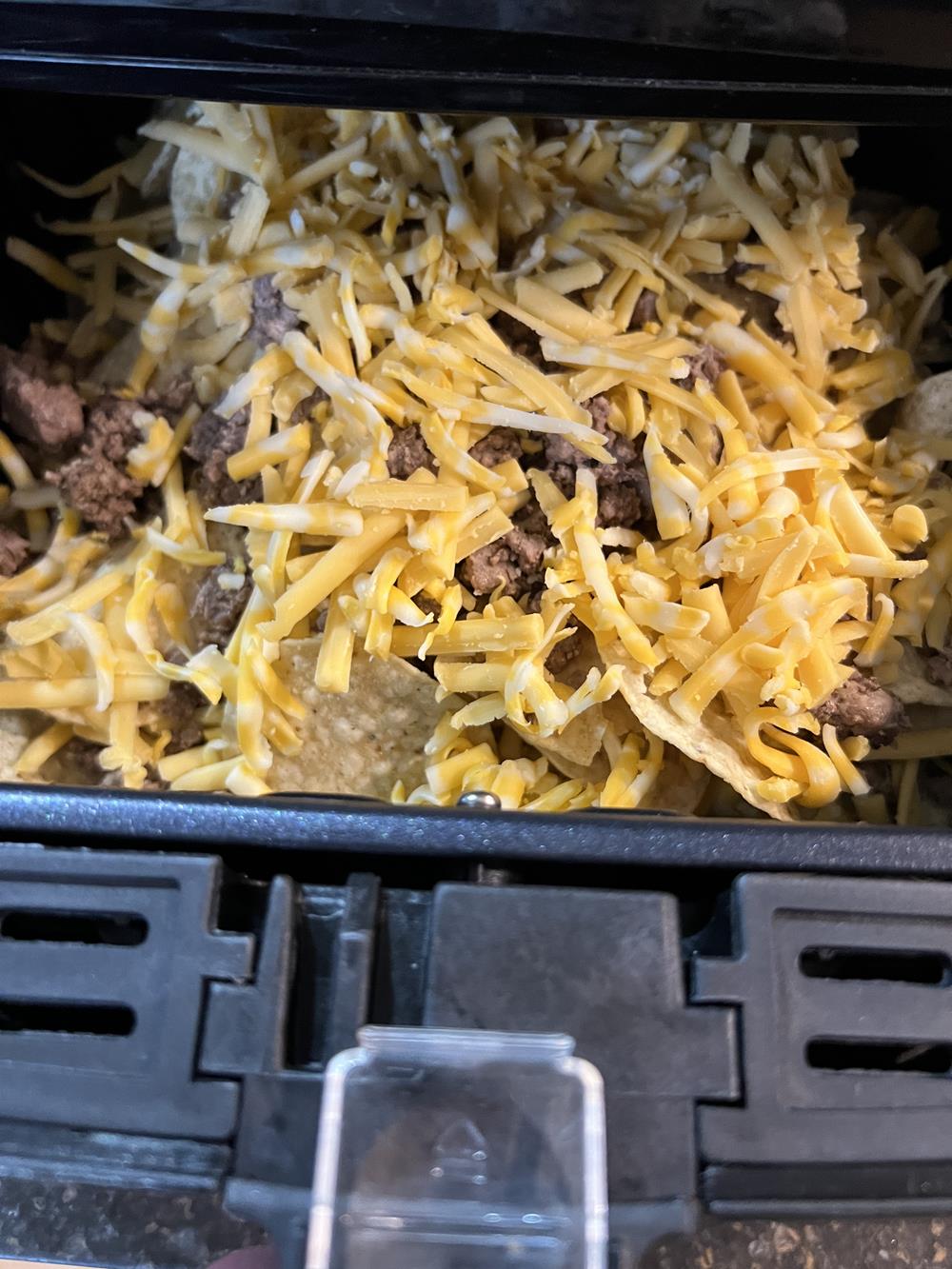 Air Fryer Nachos with meat and cheese in the air fryer