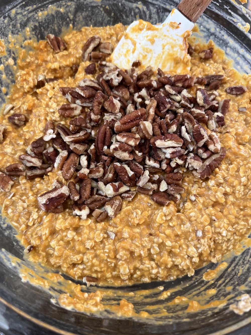 Baked Oatmeal Batter with Pumpkin and Pecans in glass bowl