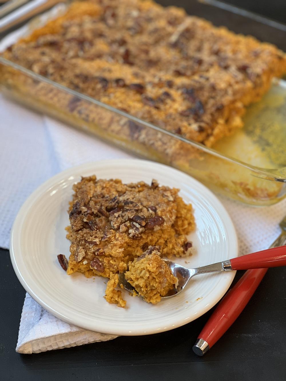 Pumpkin Pecan Baked Oatmeal Recipe on white plate with red handled fork