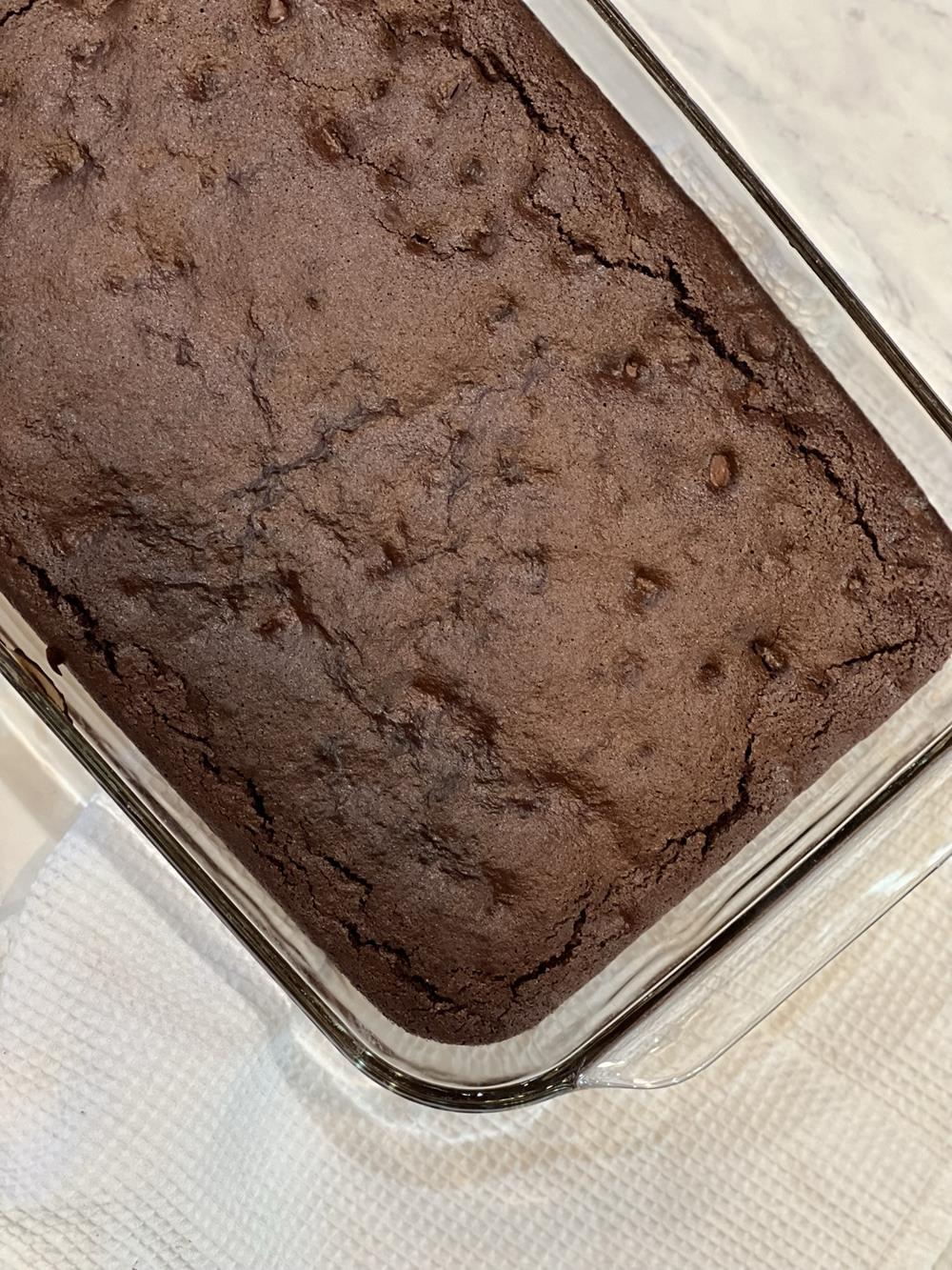 Double Chocolate Gluten Free Brownies in glass pan on white napkin