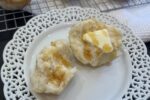 Gluten Free Muffin Pan Rolls with Honey on white plate