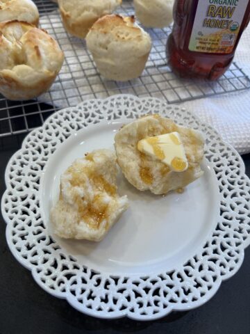 Gluten Free Muffin Pan Rolls with Honey on white plate