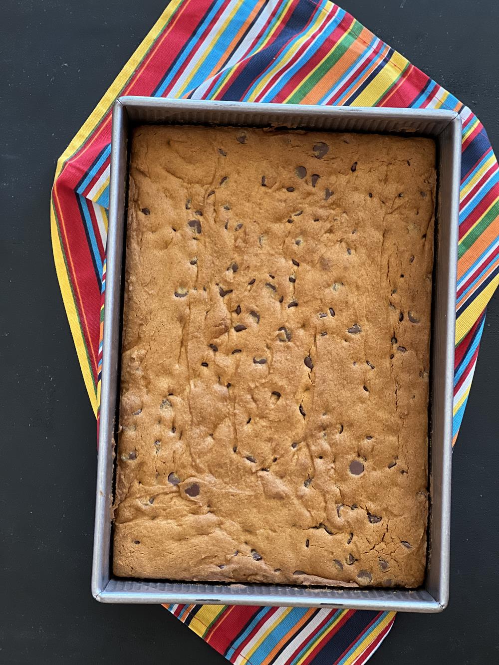 Gluten Free Pumpkin Chocolate Chip Bar Recipe in pan on striped napkin