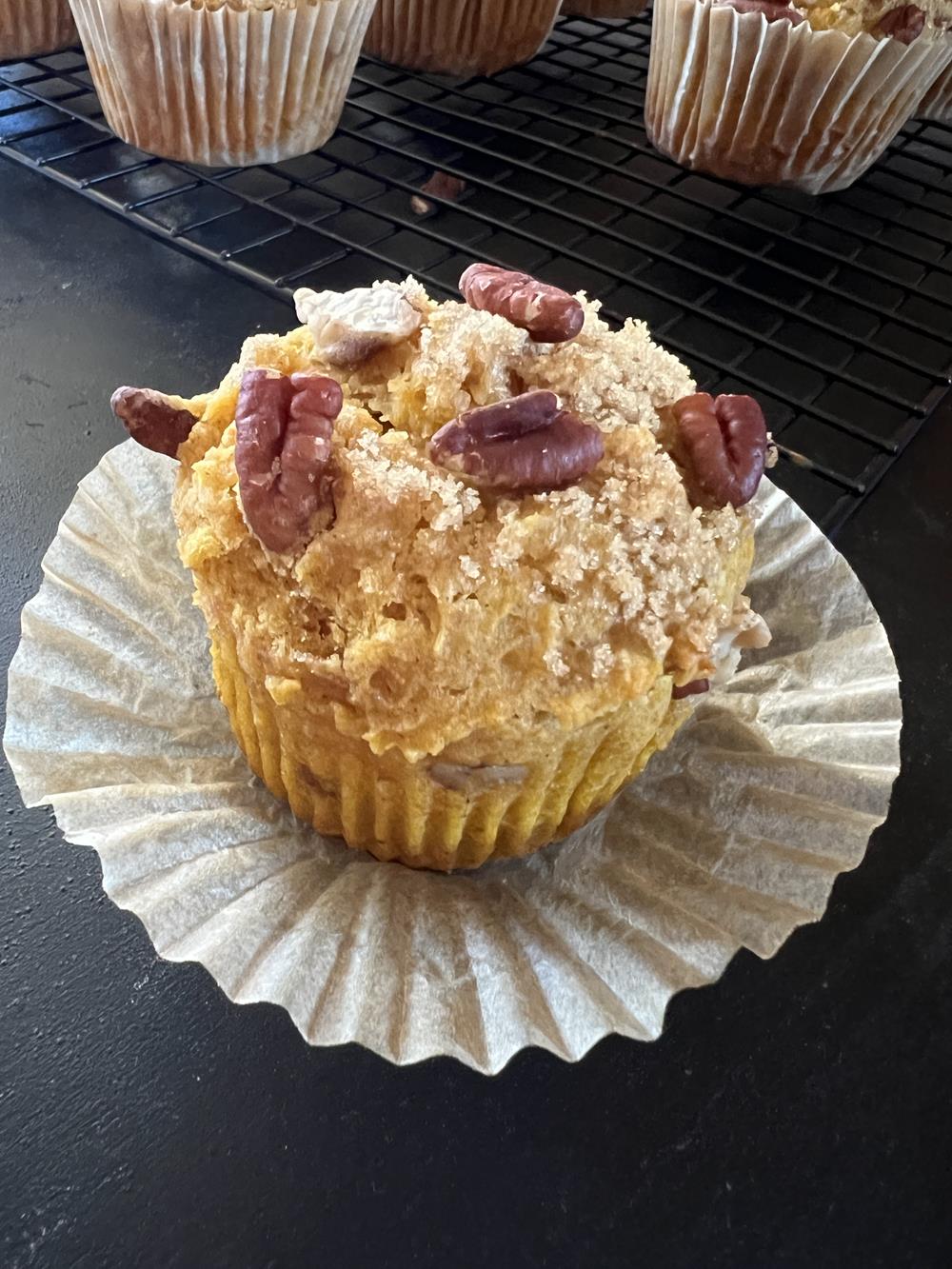 gluten free pumpkin muffin with pecans on top