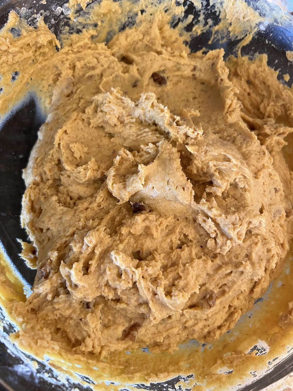 pumpkin muffin batter in glass bowl