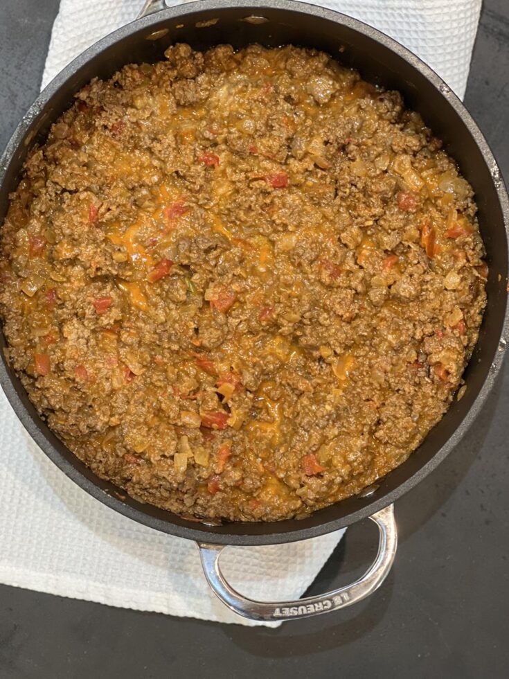 Queso Sloppy Joes in pan on white kitchen towel