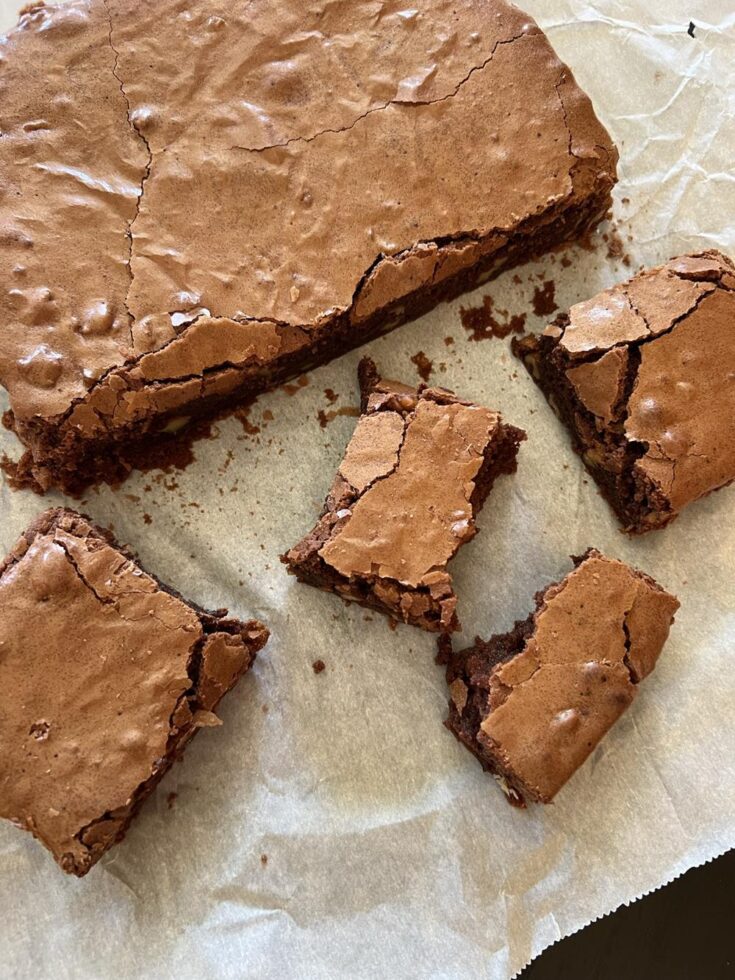 brownies cut up on parchment paper