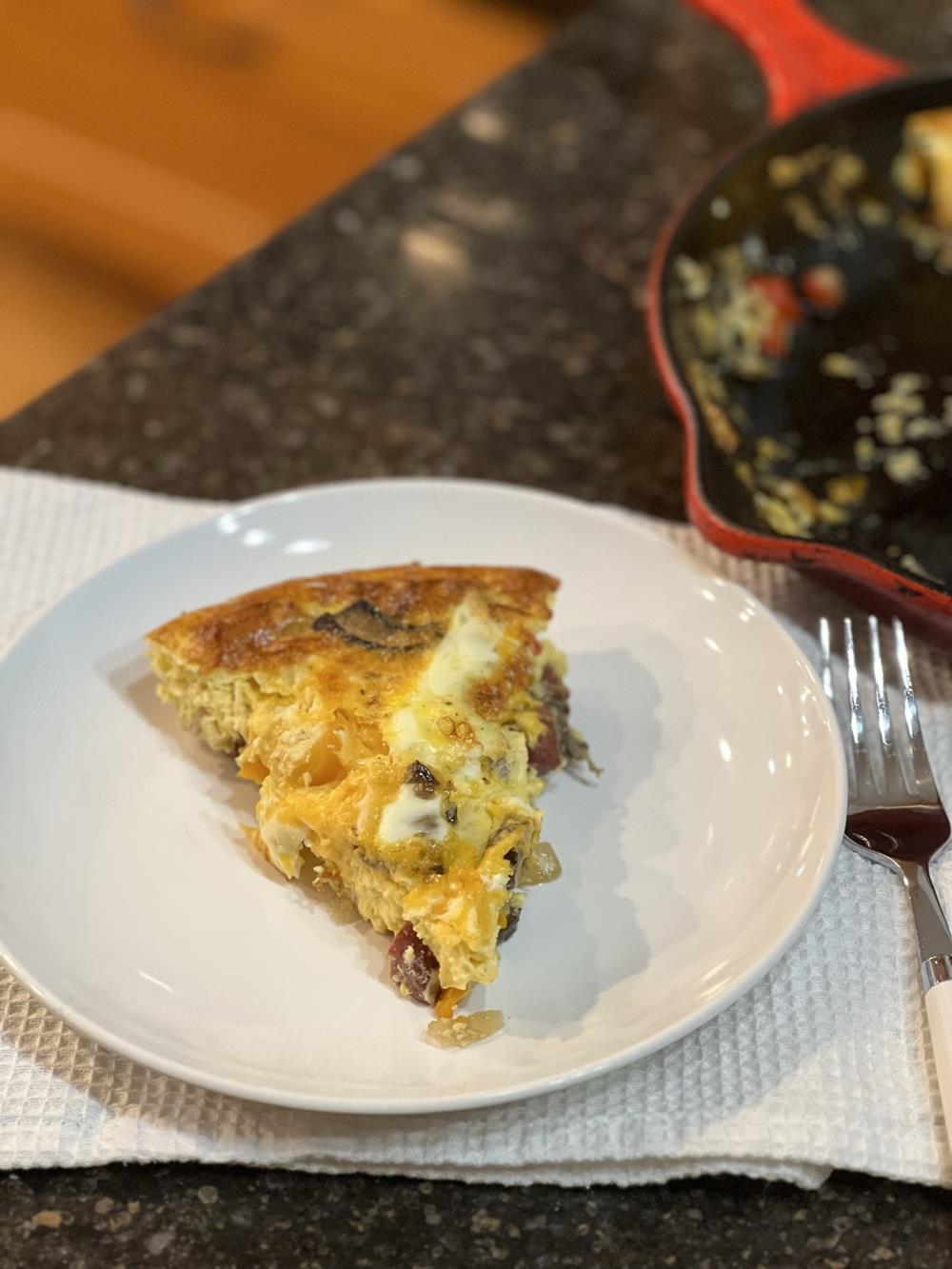 cooked frittata on white plate