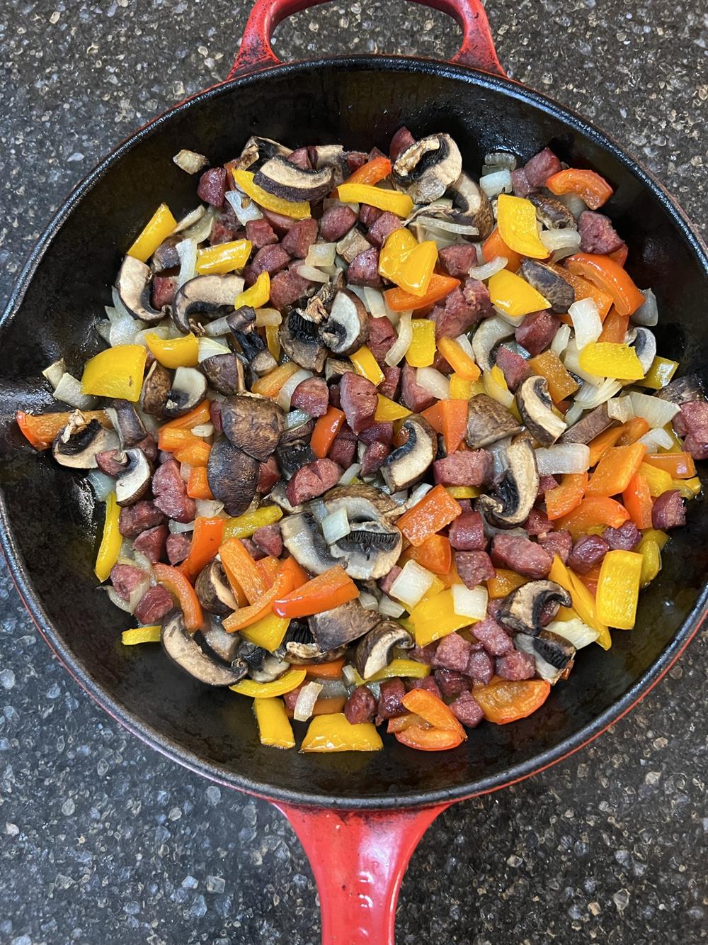 vegetables and meat in cast iron pan