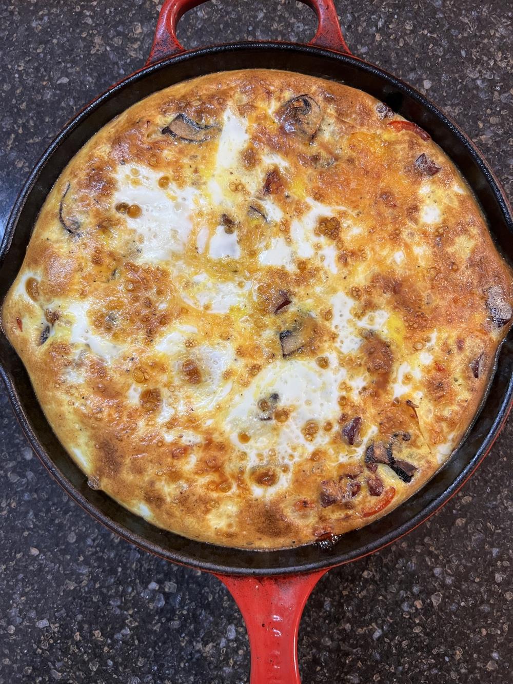 cooked frittata in cast iron pan