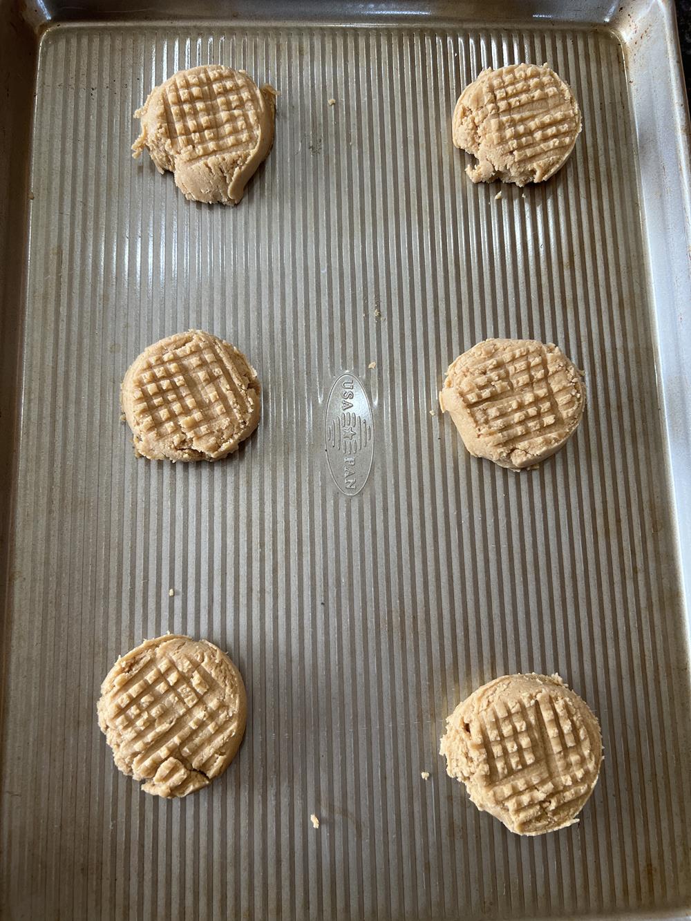 peanut butter cookie dough on cookie sheet