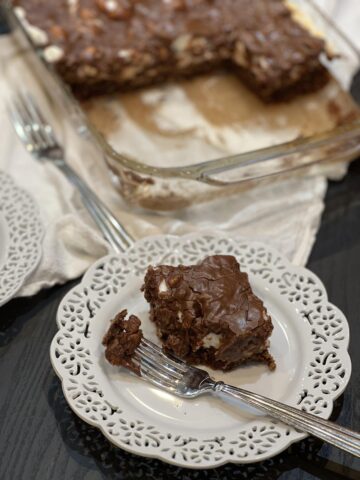 Mississippi mud cake on white plate with fork