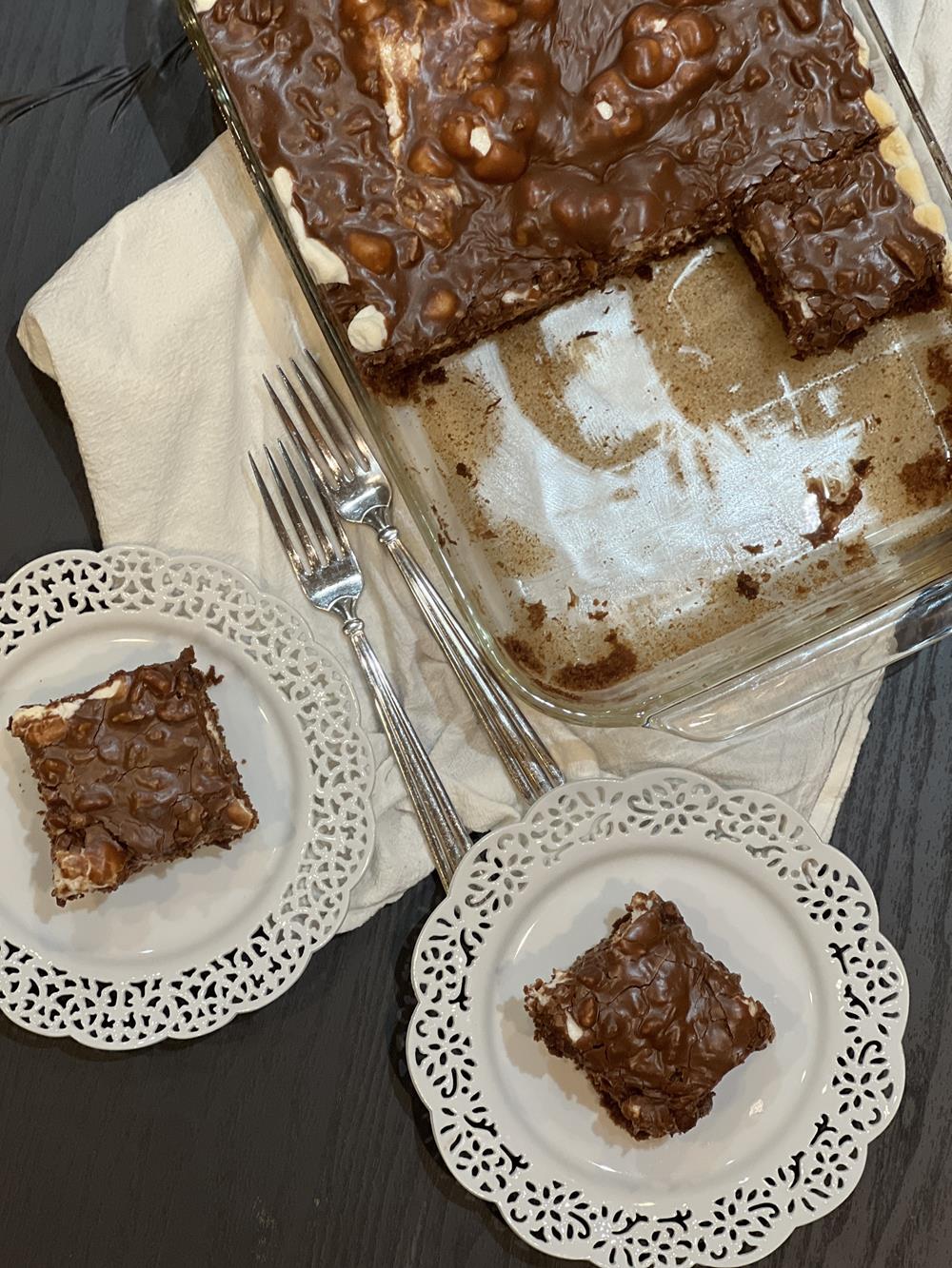 gluten free Mississippi mud cake on white plates and cake in glass pan