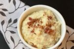 white bowl of loaded mashed potatoes