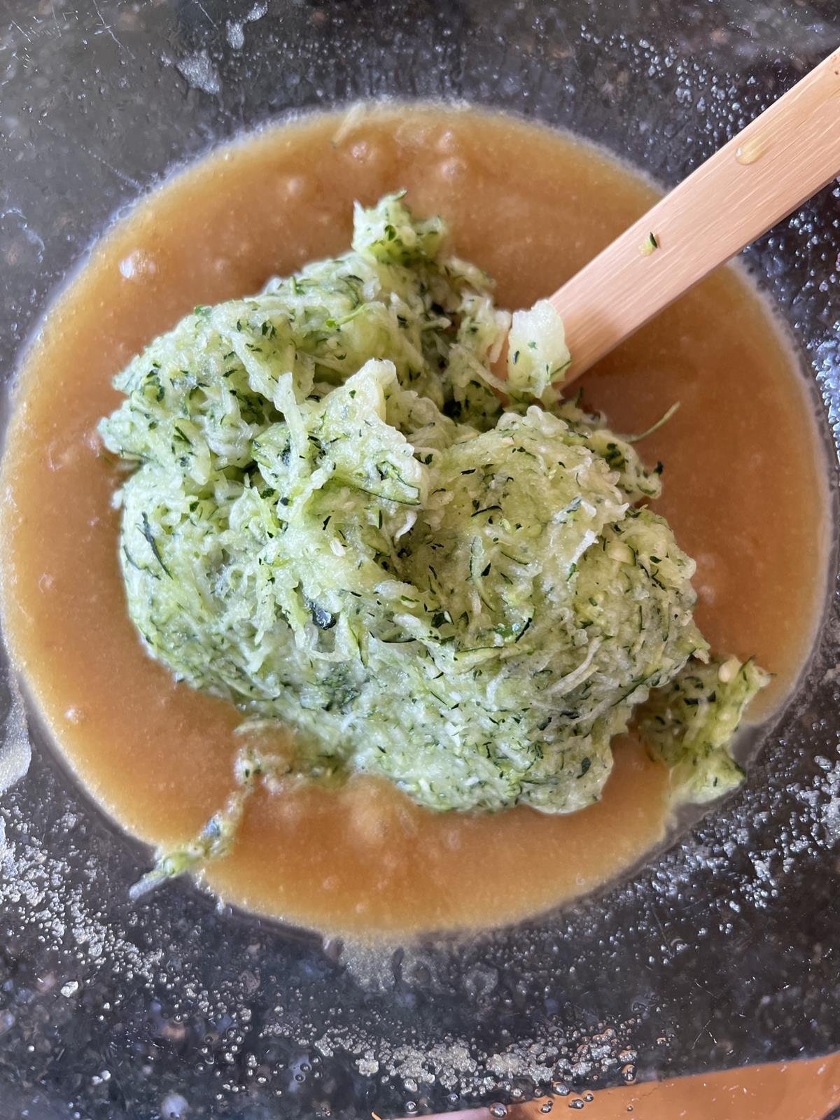 zucchini cake batter in glass bowl