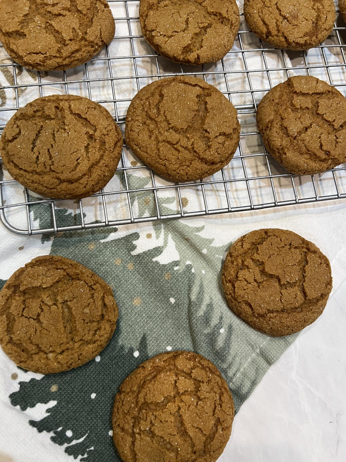 molasses cookies on cooling rack with Christmas napkin