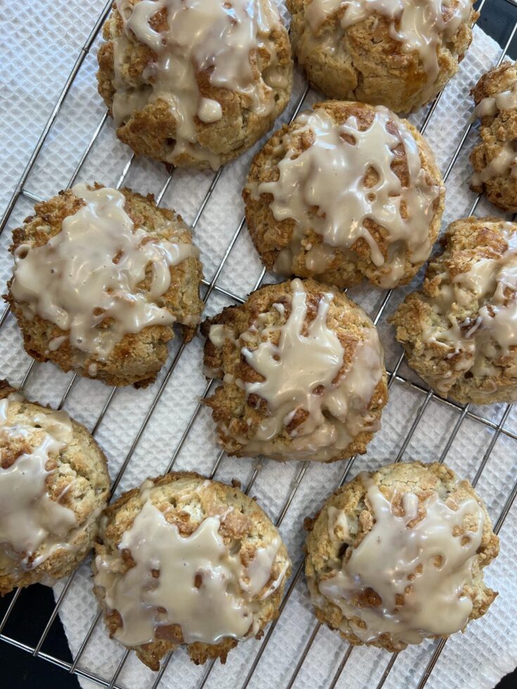 gluten free maple scones on cooling rack on white cloth on black counter