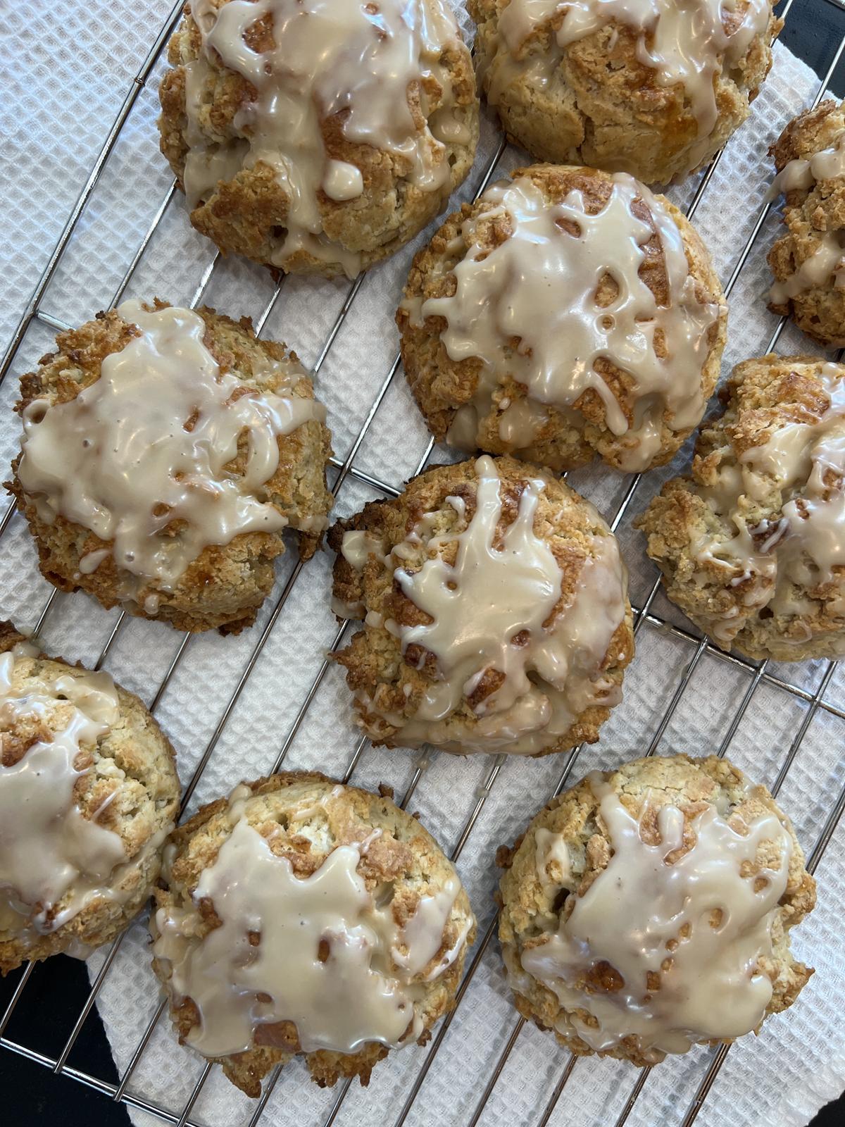 gluten free maple scones on cooling rack on white cloth on black counter