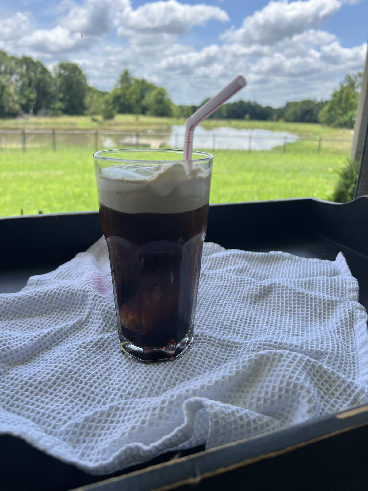 coco cola float on black table outside