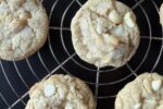 close up of gluten free white chocolate macadamia nut cookie on cooling rack