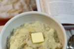 buttermilk mashed potatoes and butter in white bowl