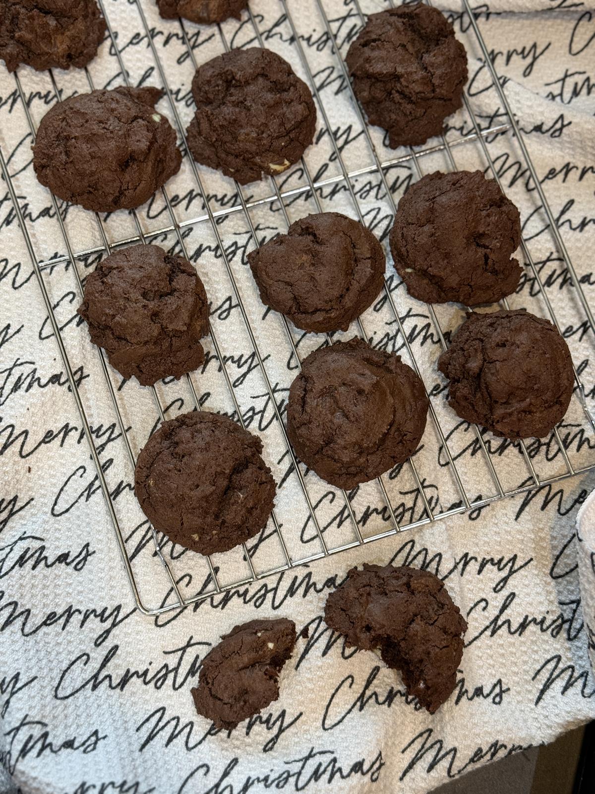 gluten free andes mint cookies on cooling rack with Merry Christmas towel in the background