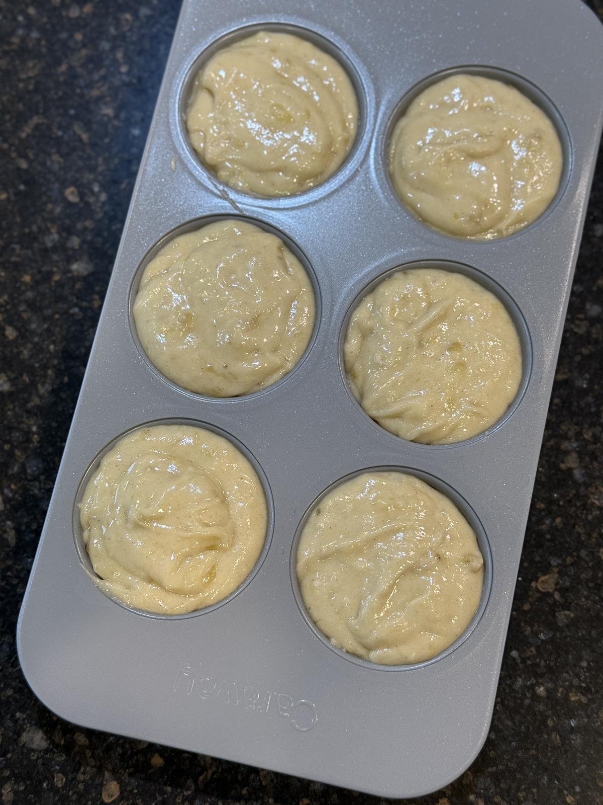 gluten free muffin batter in 6 cup muffin pan