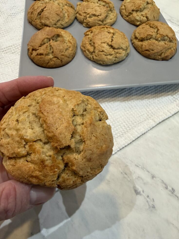 Peanut Butter Banana Muffin with pan of muffins in background