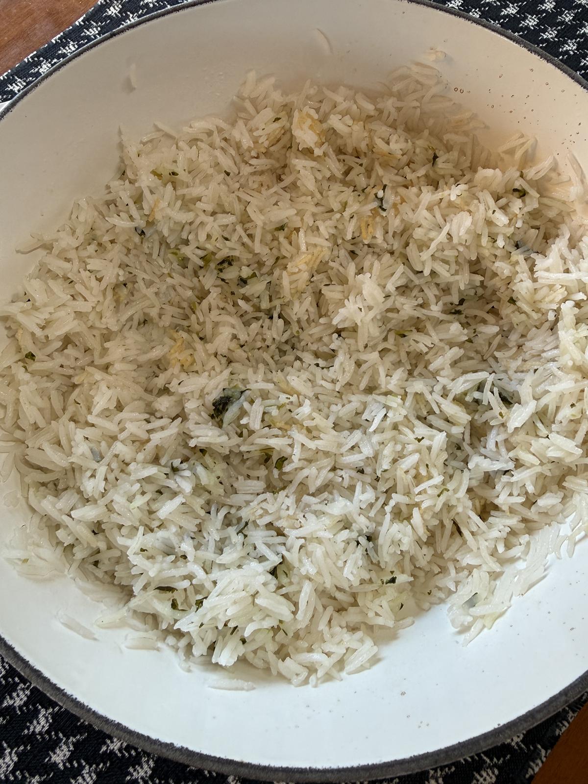cilantro lime rice in pan on black and white cloth