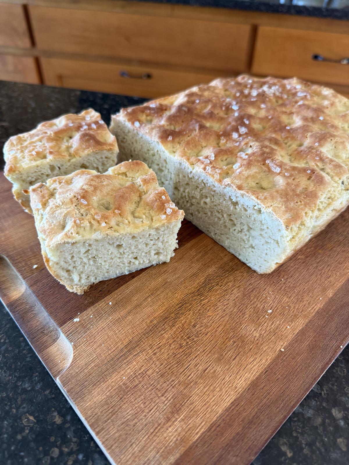 Gluten Free Sourdough Focaccia on cutting board on counter