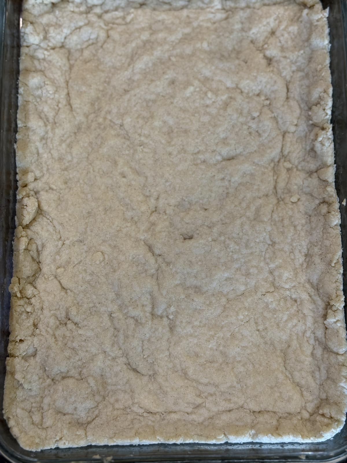 No Bake Peanut Butter Bars Crust in glass pan