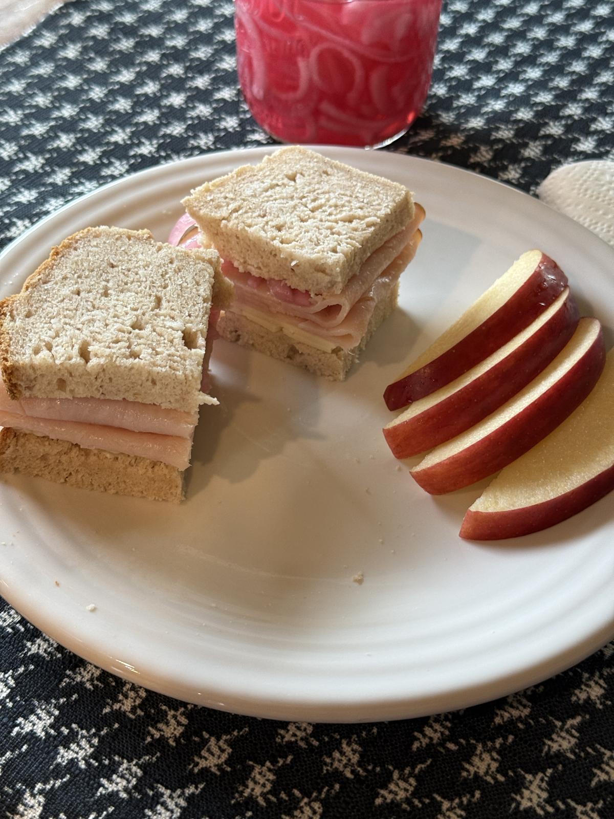 a sandwich with pickled onions and apples on the plate