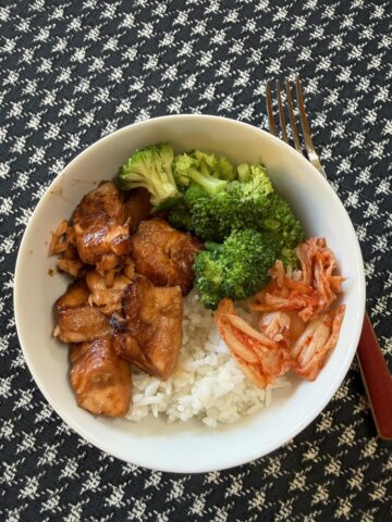 Air Fryer Teriyaki Salmon, rice, broccoli and kimchi in a white bowl