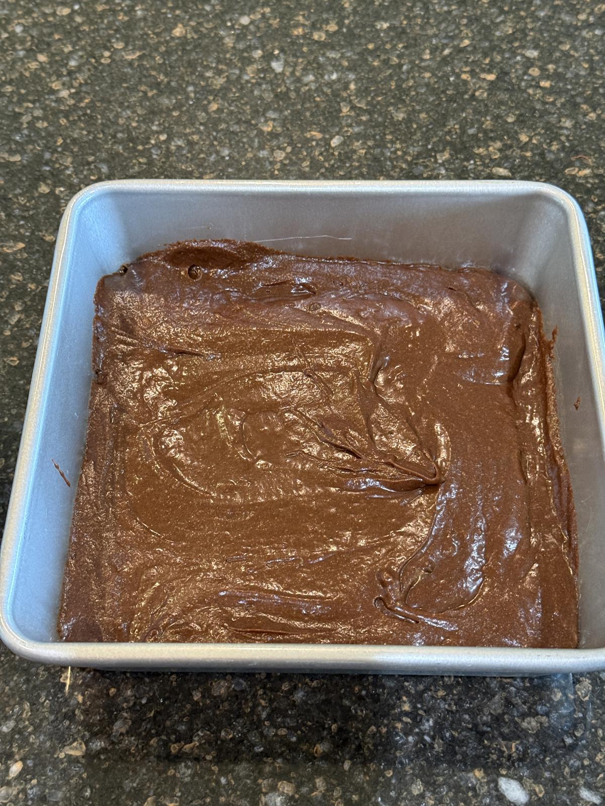 brownie batter in metal pan