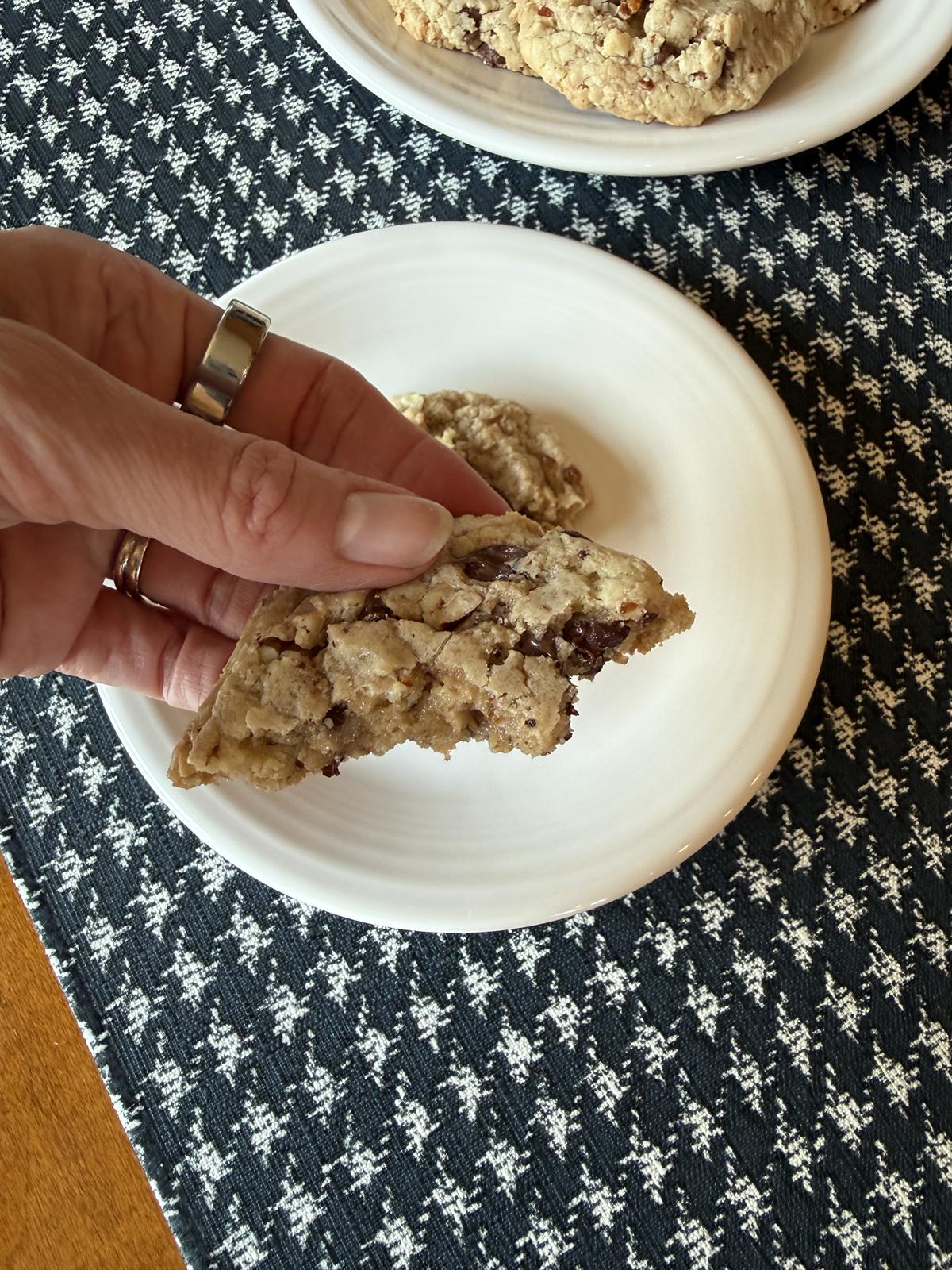 hand holding gluten free toffee pecan cookie recipe